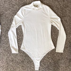 Small white women’s body suit. Never worn.